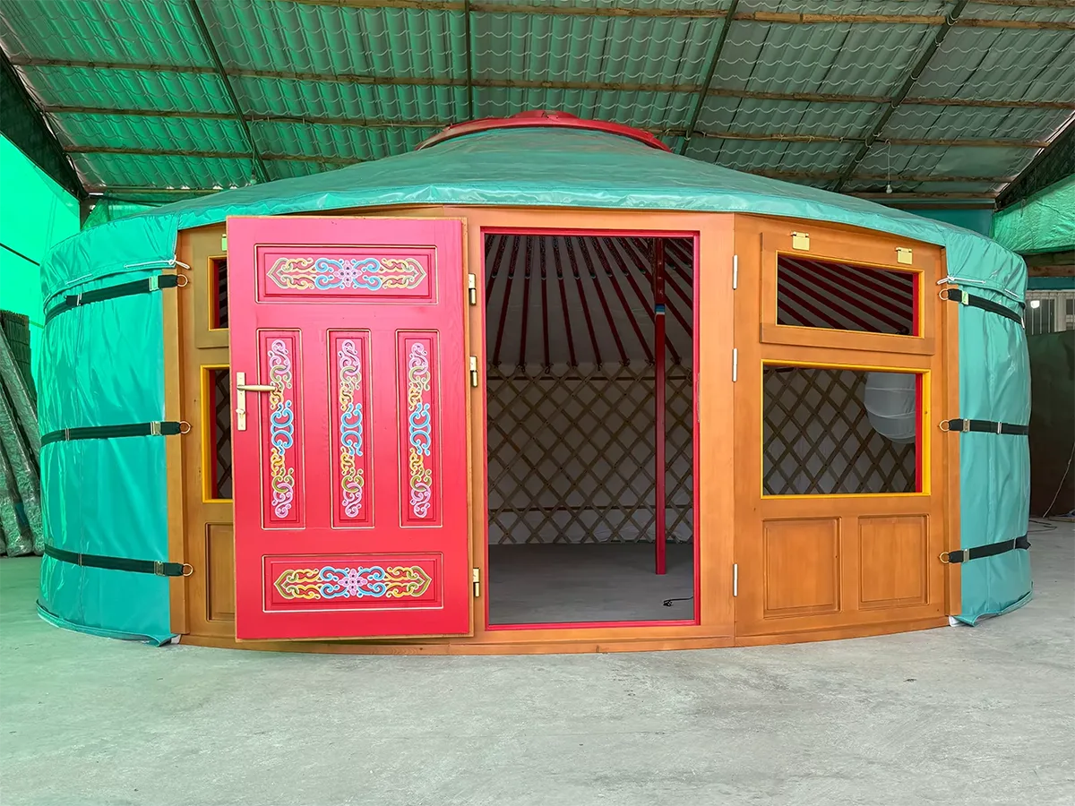 A yurt with door painted in red on the interior and brown on the exterior