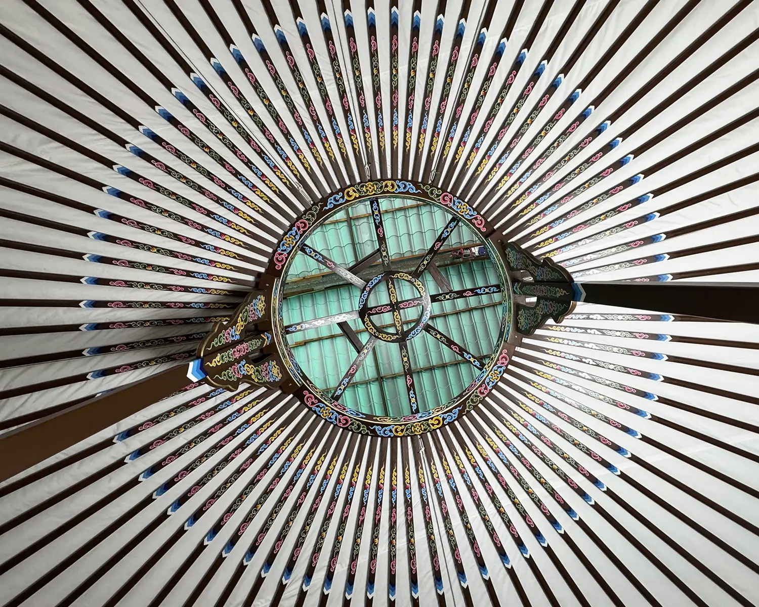 Rafters of Mongolian yurt painted in brown color and with motif decoration