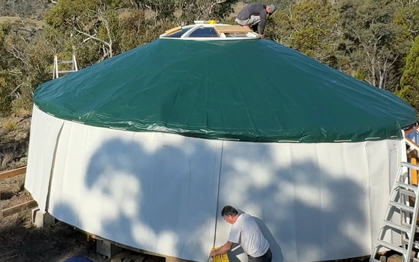 Green outer cover put on roof of a Mongolian yurt
