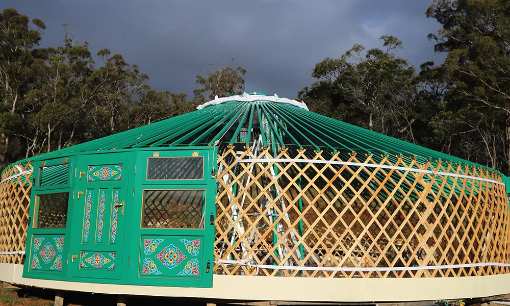 Wood frame of a 11m /36ft yurt in green painting