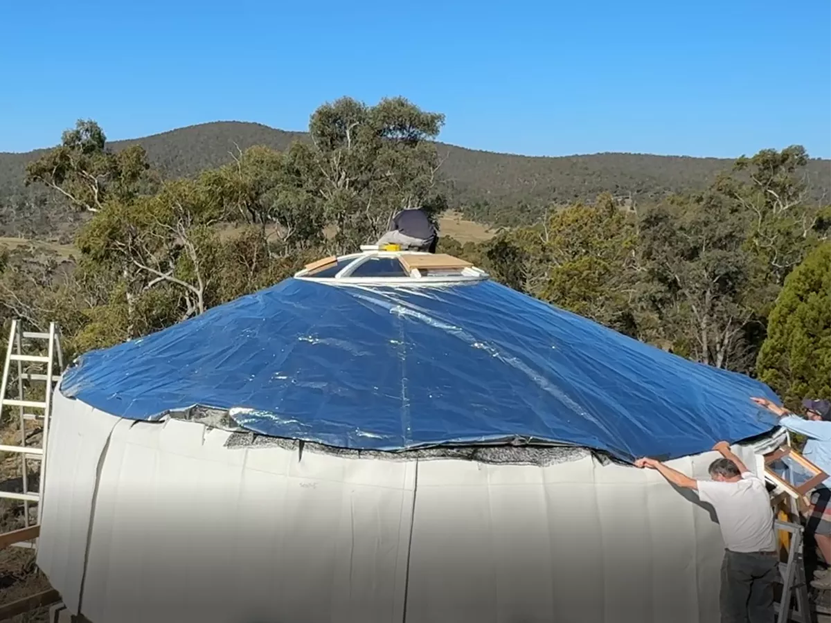 Reflective insulation layer placed on a roof of a Mongolian yurt