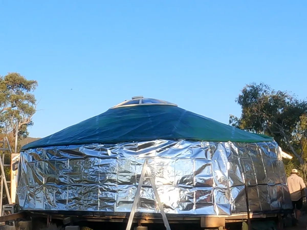 Reflective insulation layer is placed on the wall of a Mongolian yurt
